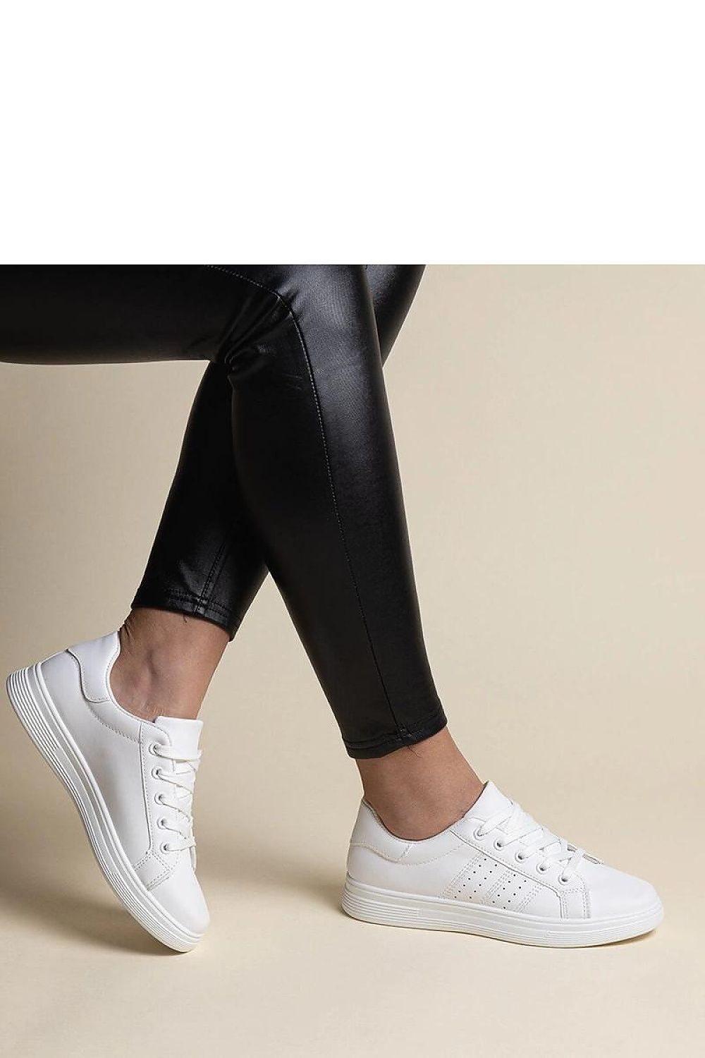 Elegant Solea white eco leather sneakers with fashionable black accents, ideal for spring and summer adventures.