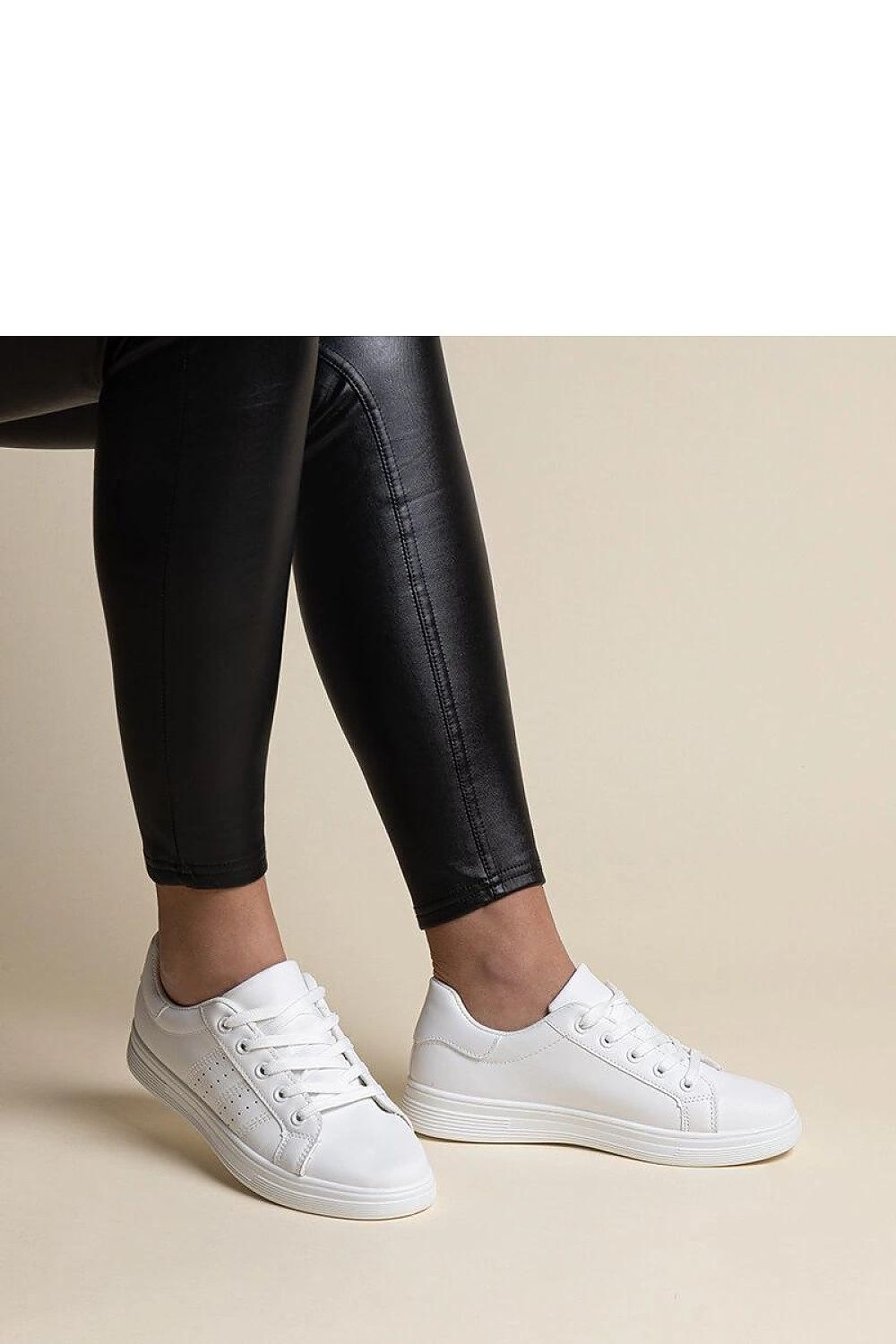 Comfortable Solea white sneakers with sophisticated black detailing, suitable for modern style seekers and eco-conscious consumers.