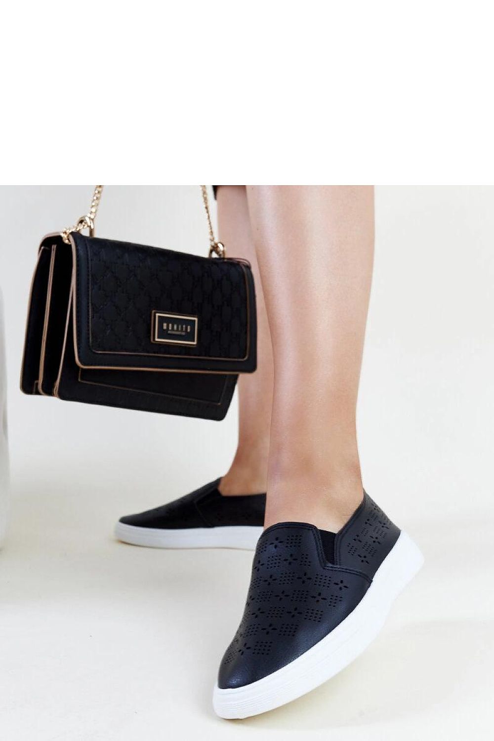 Elegant Solea beige slip-on sneakers for women, crafted from eco leather with decorative perforation for a fresh summer look.