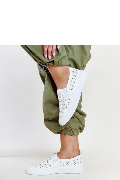 Elegant Solea beige slip-on sneakers for women, made from eco leather, featuring decorative perforation, ideal for summer outfits.