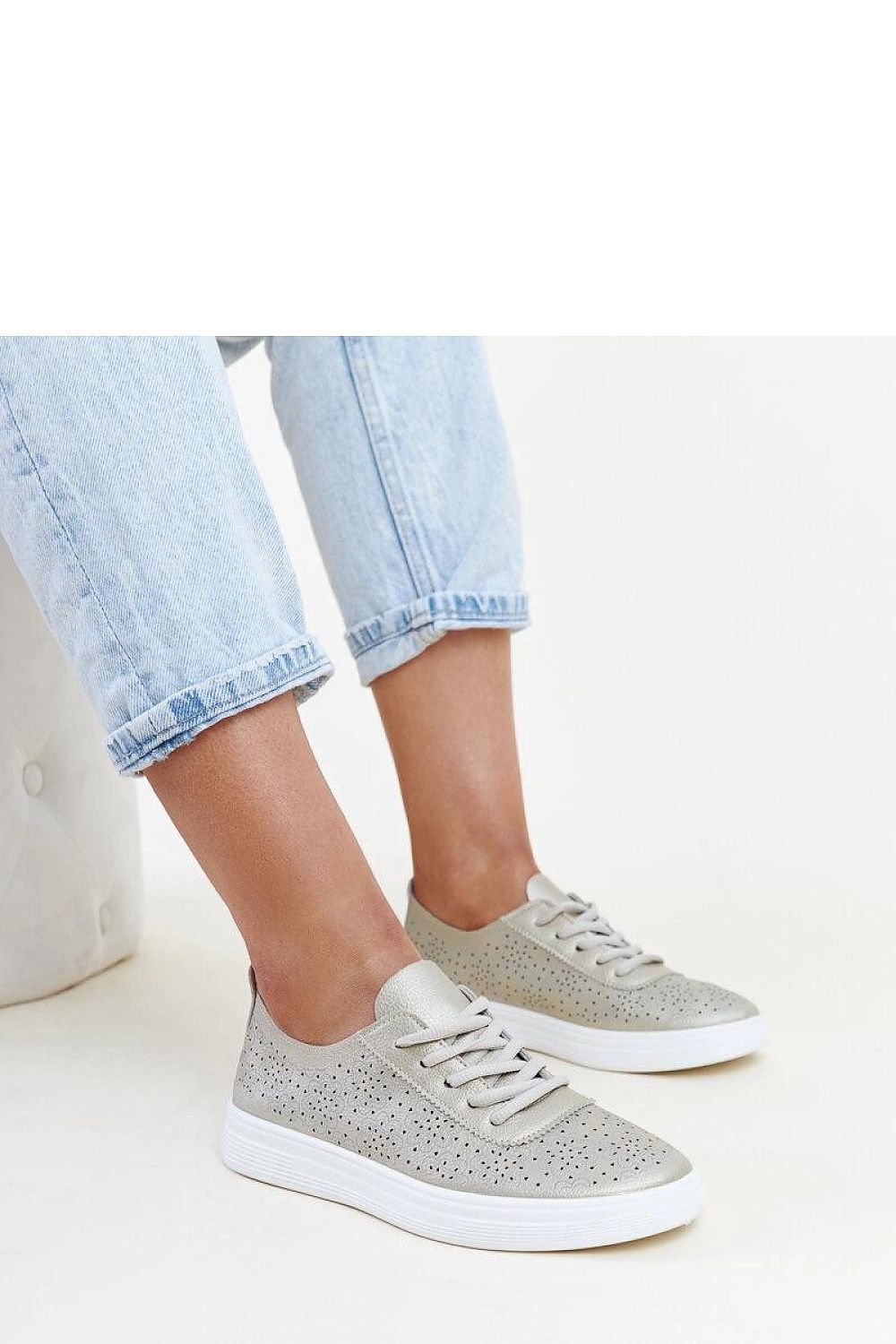 Elegant Solea golden eco leather Whitley sneakers displayed prominently, featuring a durable rubber sole and classic rounded toe, ideal for sophisticated everyday style.