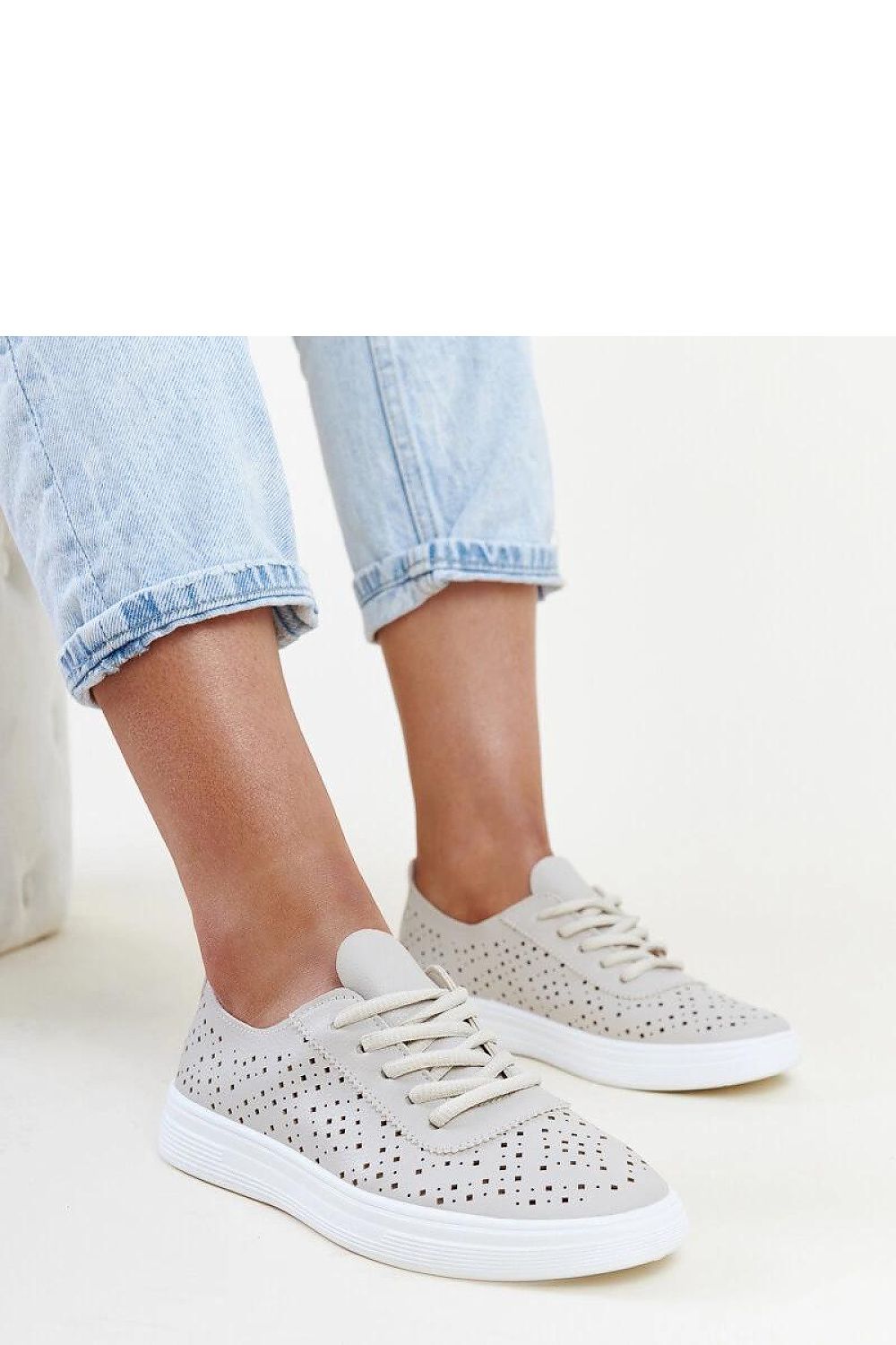 Stylish Solea beige openwork Manoek Adidas sneakers made of eco leather, featuring perforated design for breathability and elegance.