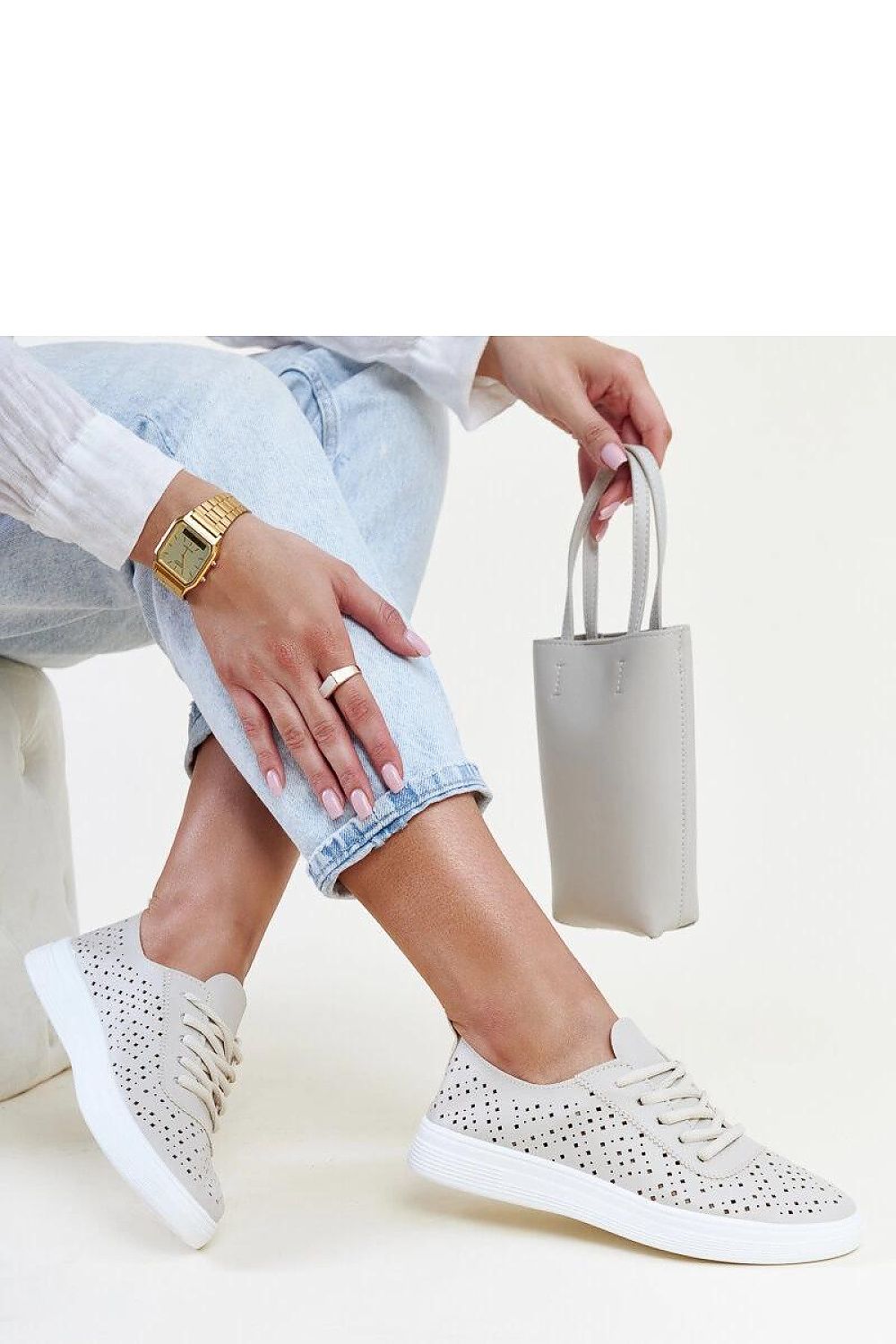 Comfortable Solea Manoek Adidas sneakers in beige, showcasing their eco-friendly leather material with a low cut and rounded toe for chic casual looks.