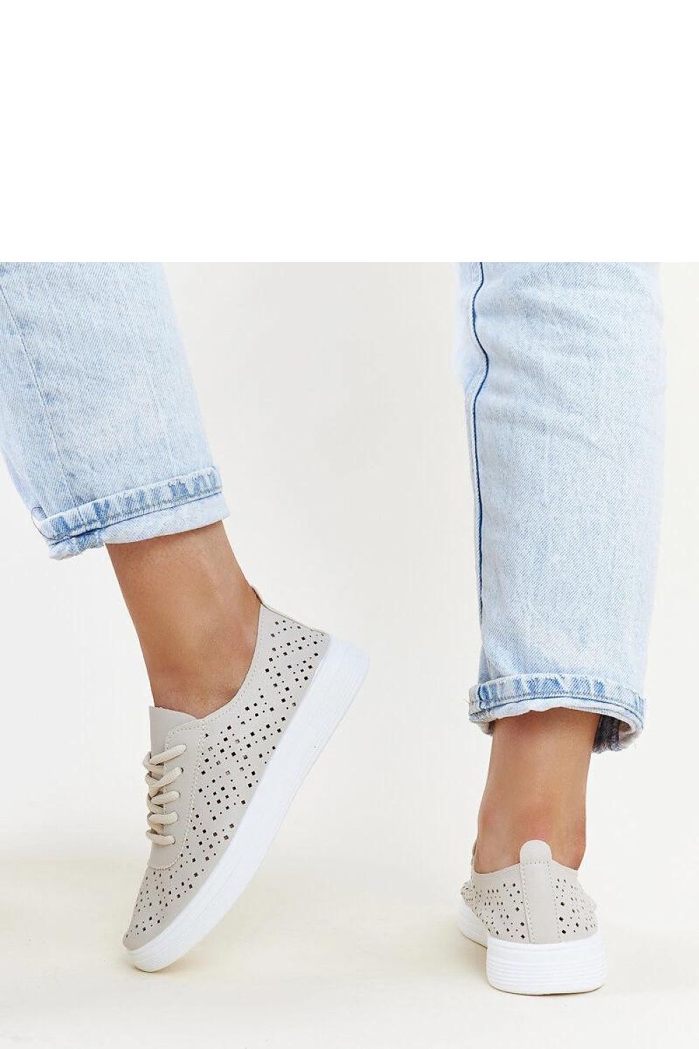 Fashionable Solea Manoek Adidas sneakers in chic beige, showcasing eco-friendly construction and versatile style, ideal for spring and summer casual outfits.