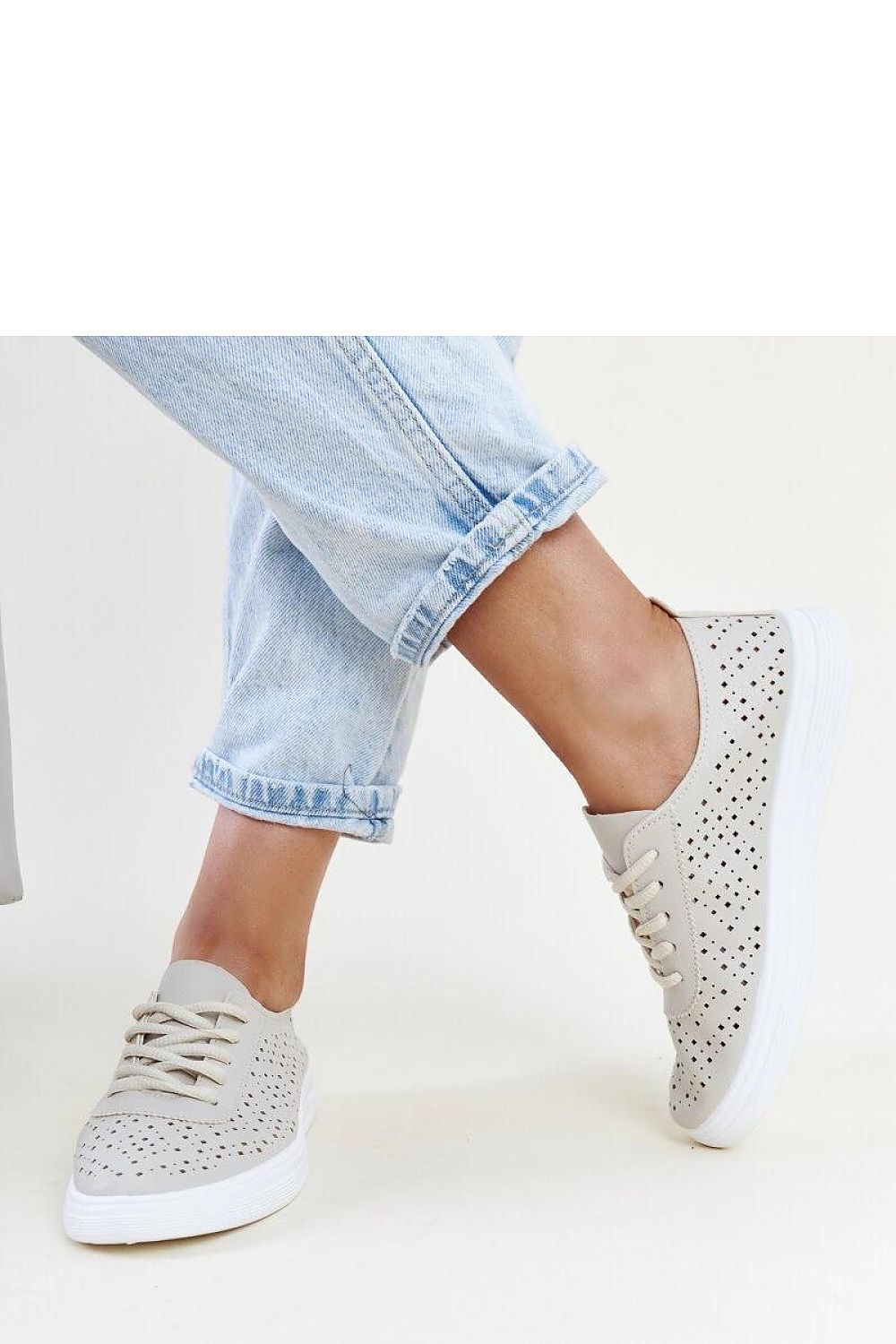 Close-up of Solea Beige Manoek Adidas Sneakers, highlighting the intricate openwork design and eco leather material, perfect luxury footwear for trendy women.