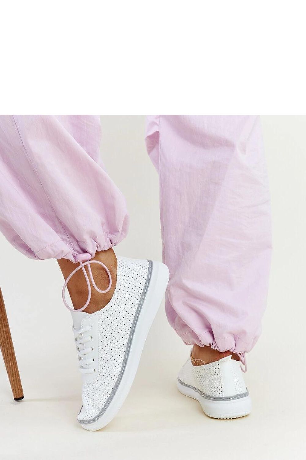 Solea stylish Biserka white and grey eco leather sneakers, perfect for an active lifestyle, showcasing the elegant lace-up design.