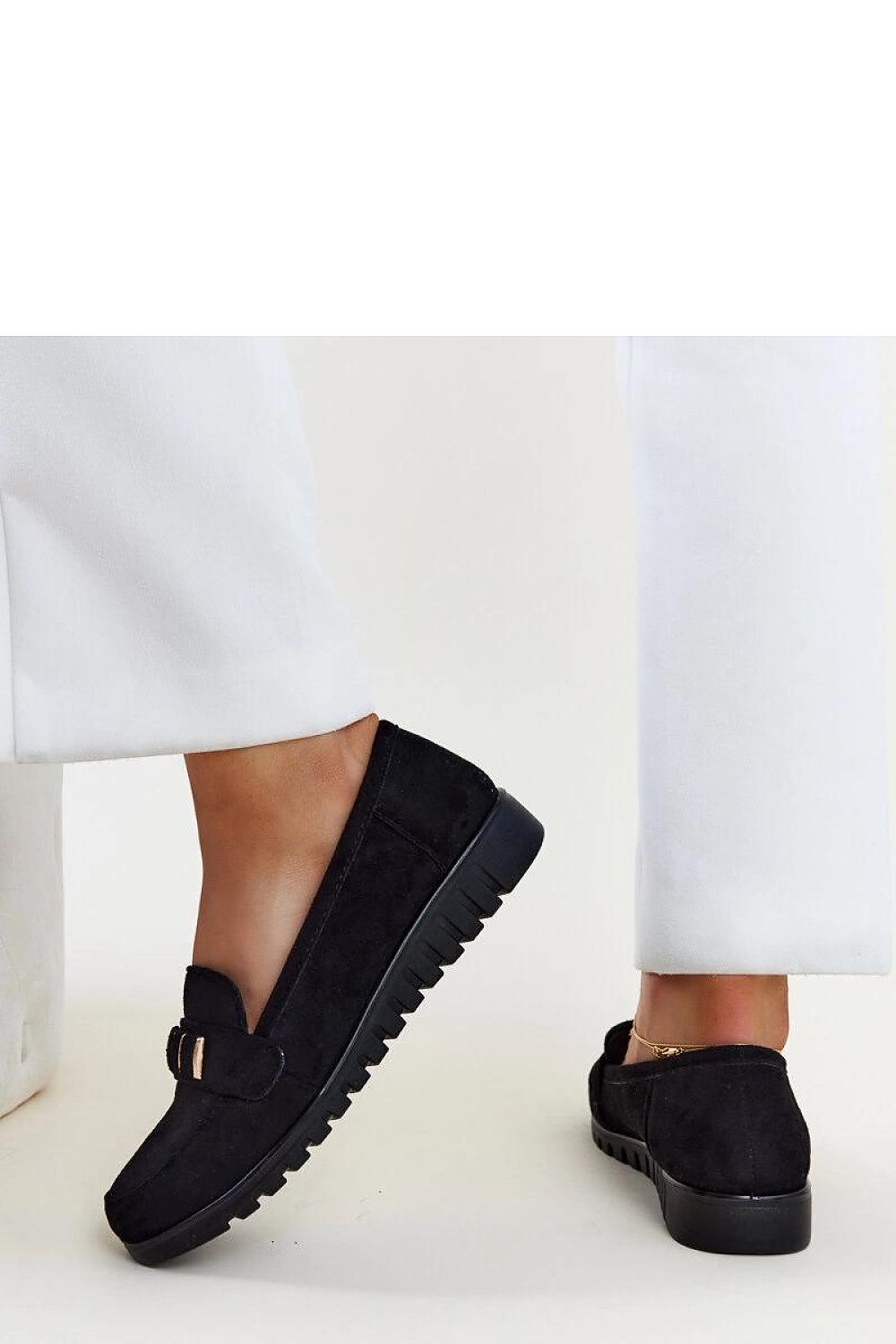 Chic Solea black patent loafers with a slip-on design, combining comfort and style for women from EU sizes 36 to 41.