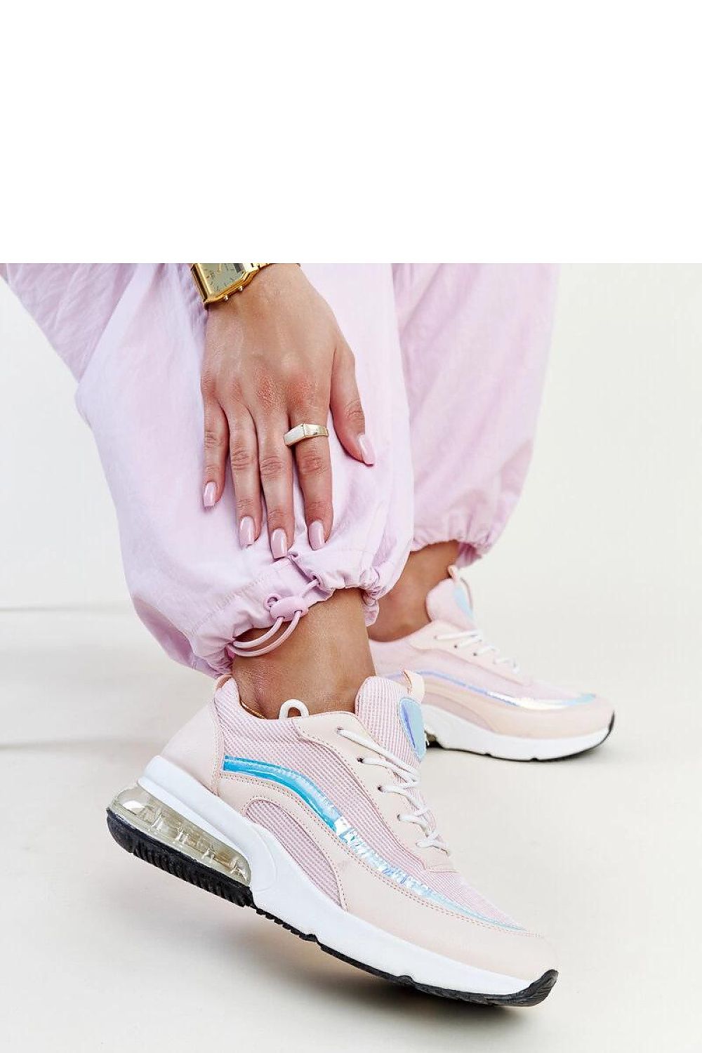 Close-up view of Solea pink hologram Jelka sneakers highlighting the elegant rubber material and innovative design features.