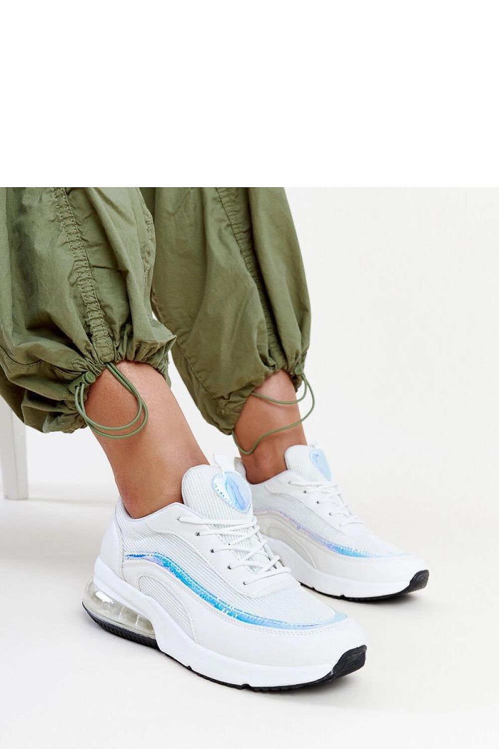 Solea pink hologram Jelka sneakers displayed against a chic backdrop, exemplifying modern luxury and unique design.