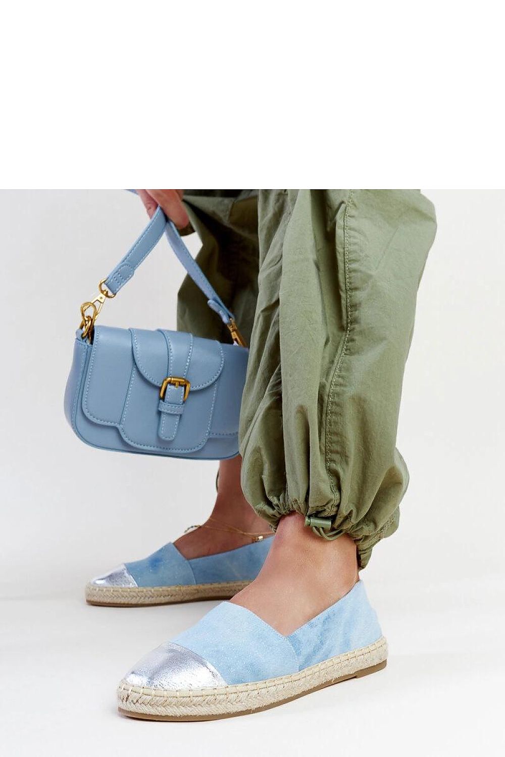 Luxurious Solea blue-silver espadrilles with a fashionable slip-on design, perfect for summer fashionistas.