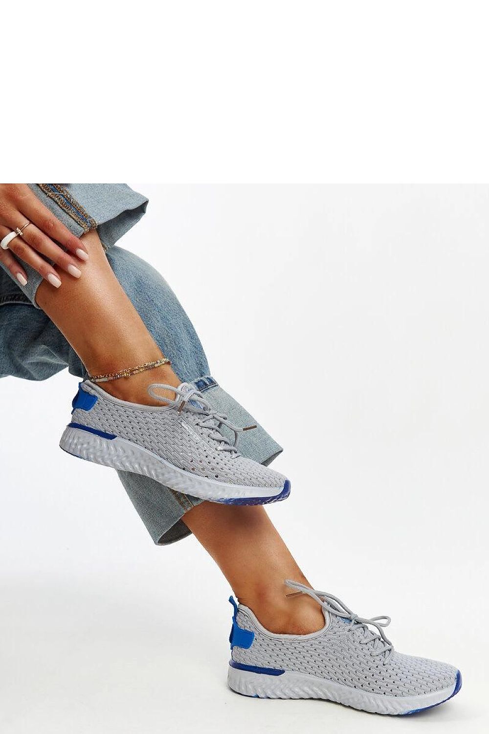 Luxury grey women's sneakers by Solea featuring a stylish low profile design and laced closure for a perfect fit, ideal for distinguished fashion.