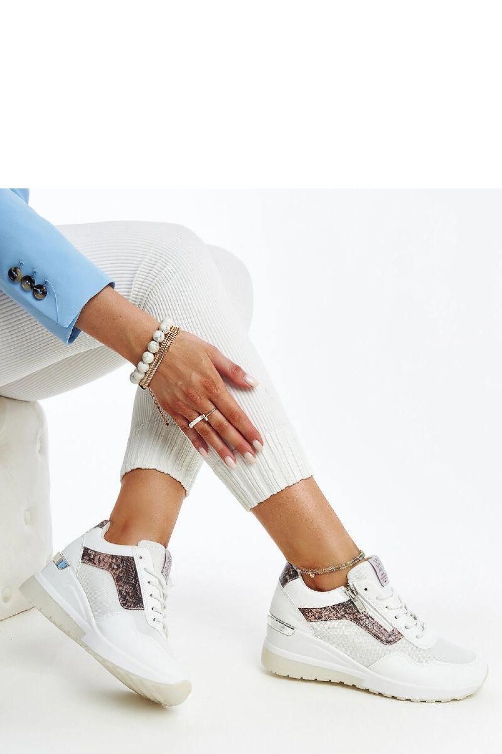 Elegantly designed white women's sneakers with wedge heel by Solea, showcasing a sporty yet chic style, suitable for everyday wear. Perfectly blending comfort and luxury, available in sizes EU 36-41 and US 5.5-10.5.