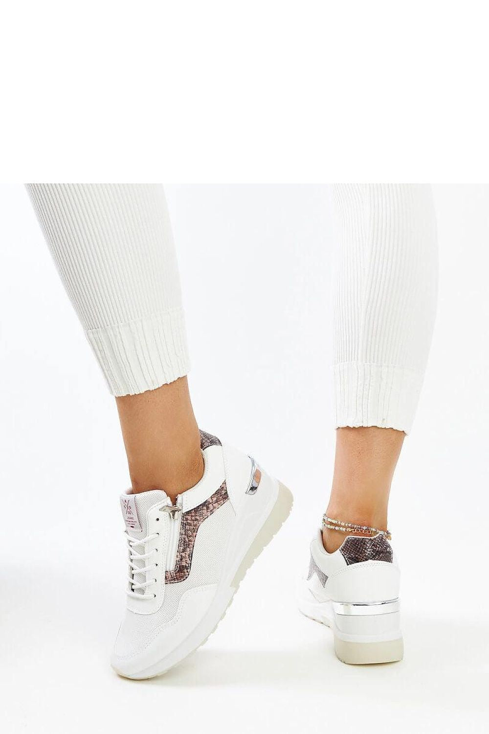 Stylish white women's sneakers with a 7cm wedge heel by Solea, ideal for adding a luxurious touch to any casual outfit.