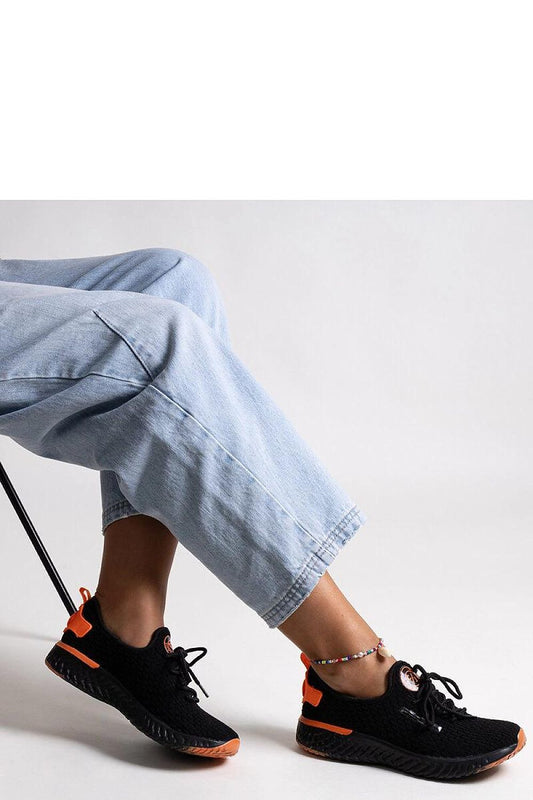 Chic black sneakers by Solea for women, showcasing a trendy lace-up closure and durable material ideal for spring/summer wear.