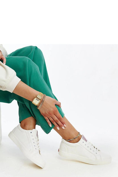 Luxurious eco-leather women's sneakers by Solea, featuring a modern rounded toe design and a flexible rubber sole, perfect for stylish everyday wear.