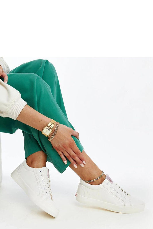 Luxurious eco-leather women's sneakers by Solea, featuring a modern rounded toe design and a flexible rubber sole, perfect for stylish everyday wear.