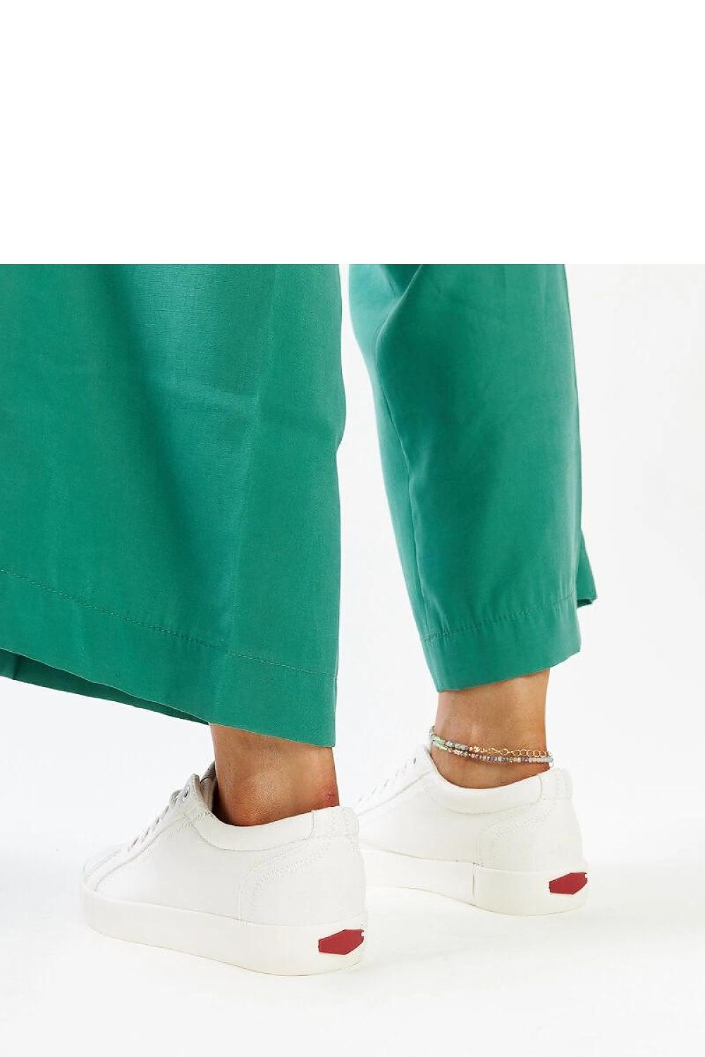 Chic white eco-leather sneakers by Solea with rubber sole, ideal for modern women seeking both elegance and versatility in their footwear.