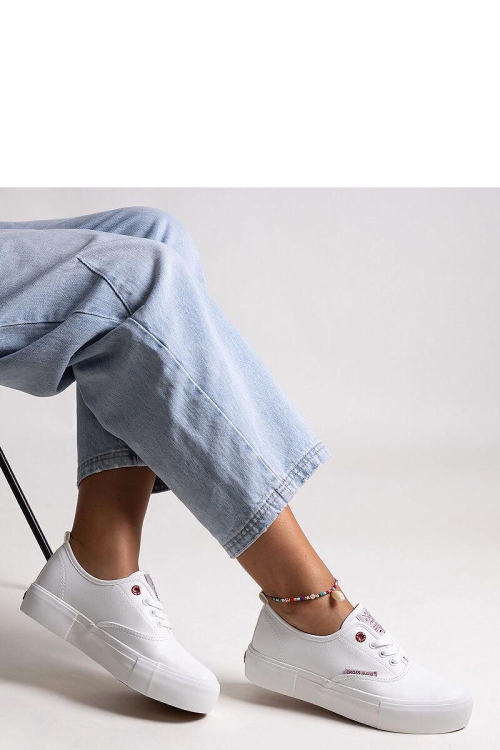 Luxury white women's sneakers with thick rubber sole by Solea, showcasing a stylish laced design and rounded toe, perfect for chic everyday outfits.