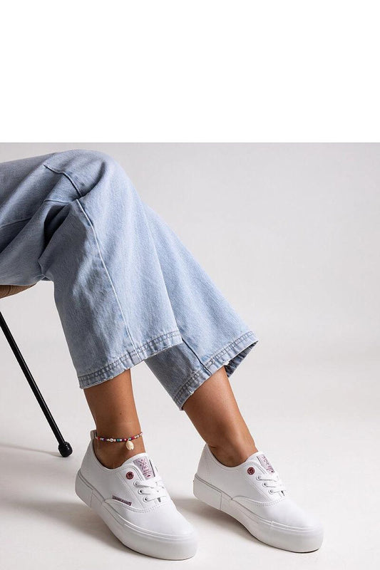 Elegant Solea women's sneakers in pristine white colour, featuring a durable thick rubber sole, designed for both comfort and trendy appeal.