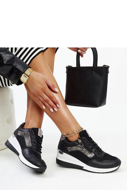 Close-up view of Solea black platform sneakers, featuring detailed stitching and round toe design for luxurious comfort and style.