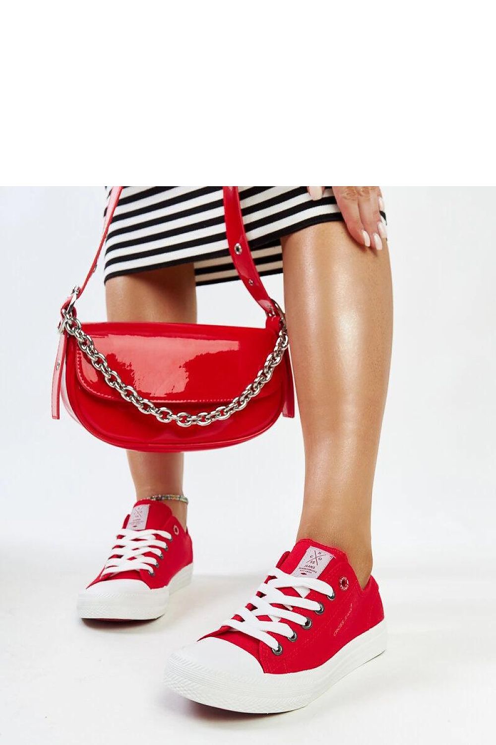 Fashion-forward red lace-up sneakers by Solea, combining modern style with a flexible rubber sole for effortless elegance.