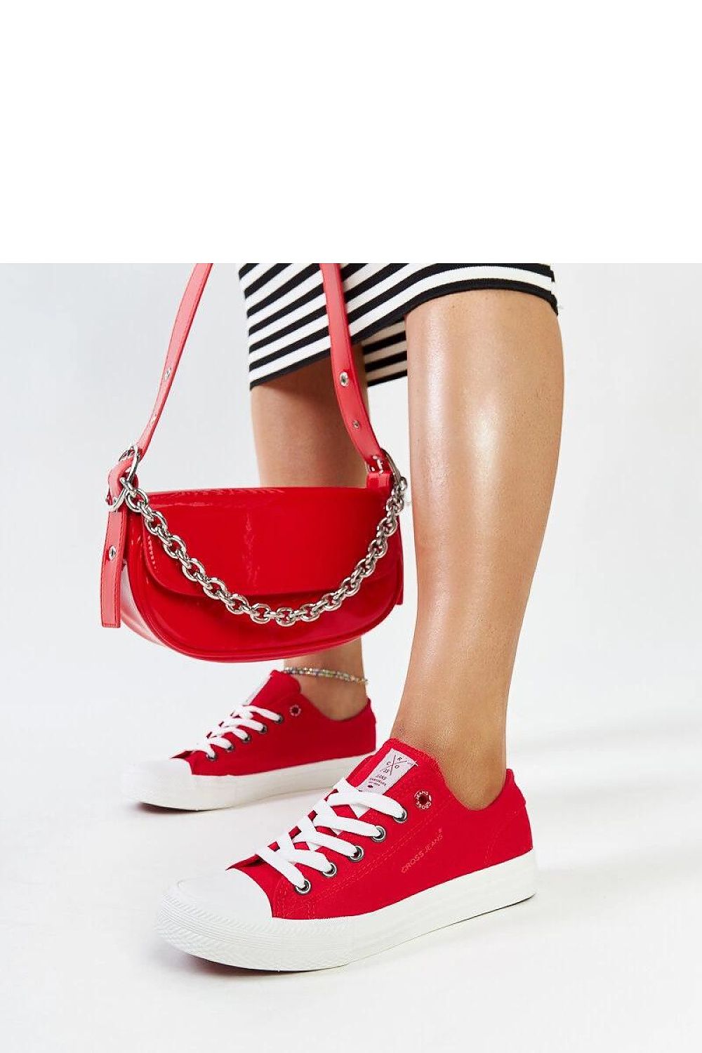Luxury red women's lace-up sneakers by Solea, featuring a flexible rubber sole and stylish rounded toe design, perfect for chic summer outfits.