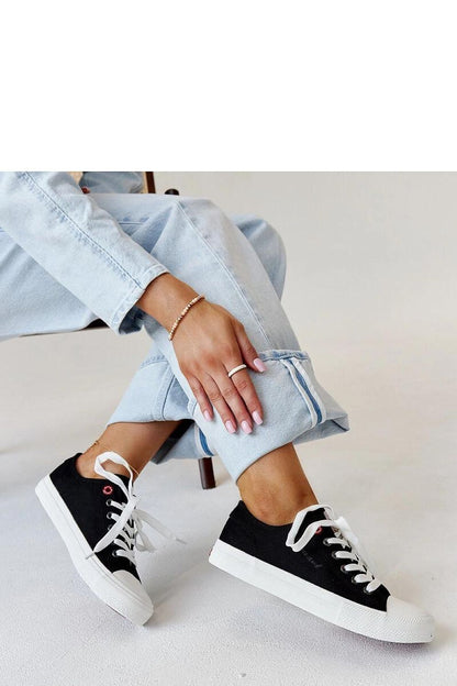 Close-up of Solea black women's lace-up sneakers, showcasing high-quality textile material and elegant rounded toe.