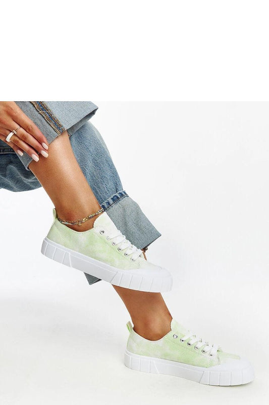 Side view of light green Jerina Adidas sneakers from Solea, crafted from premium fabric and featuring a white rubber sole for elegance and durability.