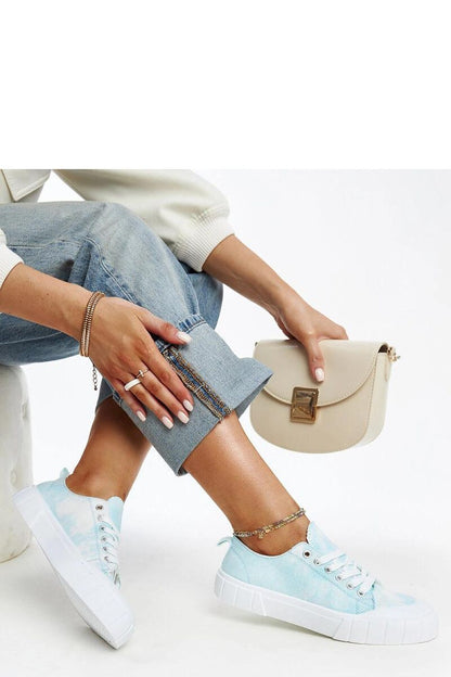 Close-up of laced light green Jerina Adidas sneakers, perfect for spring and summer, crafted by Solea.