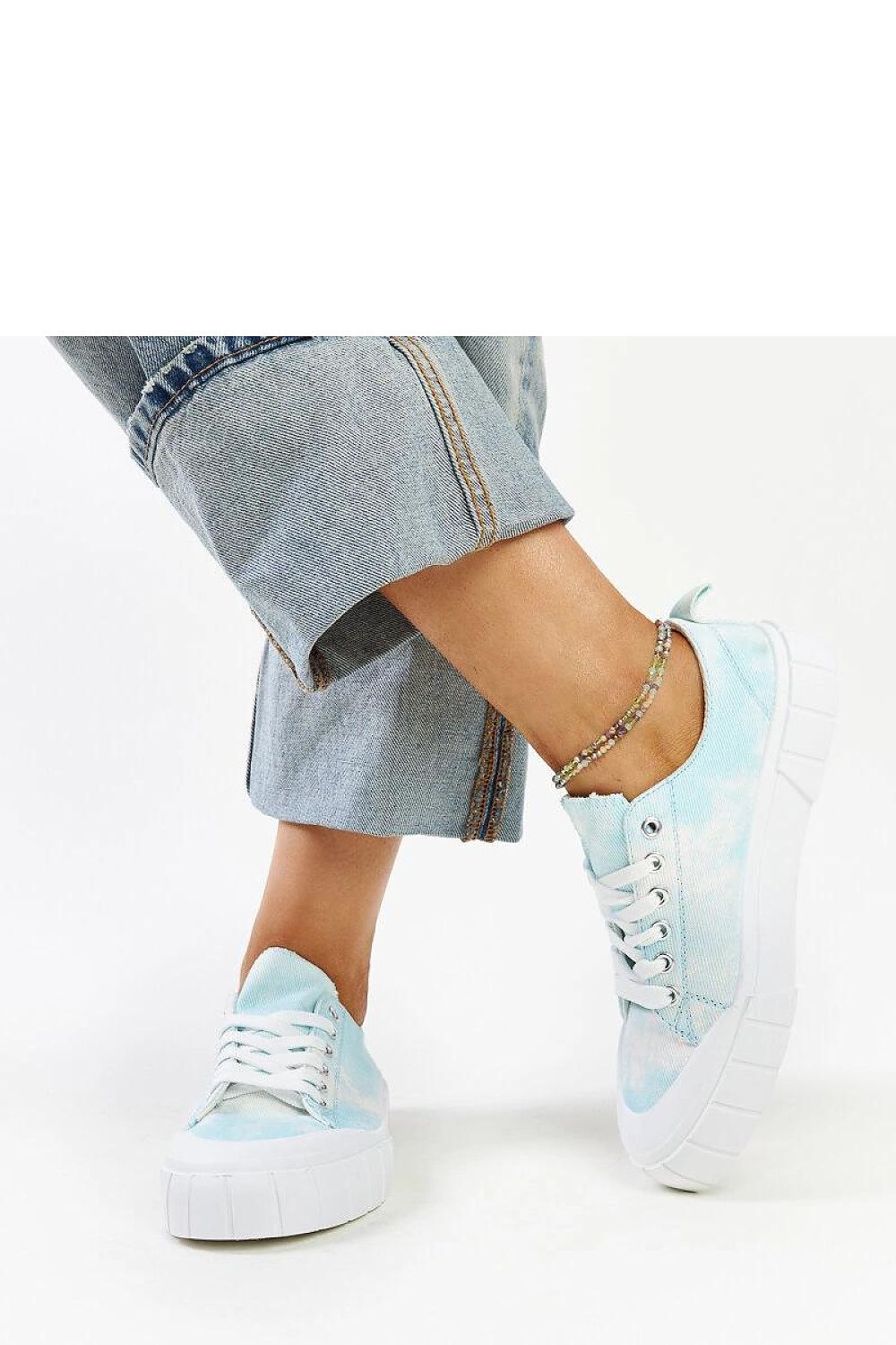 Light green Jerina Adidas sneakers against a chic backdrop, symbolizing luxury footwear by Solea.