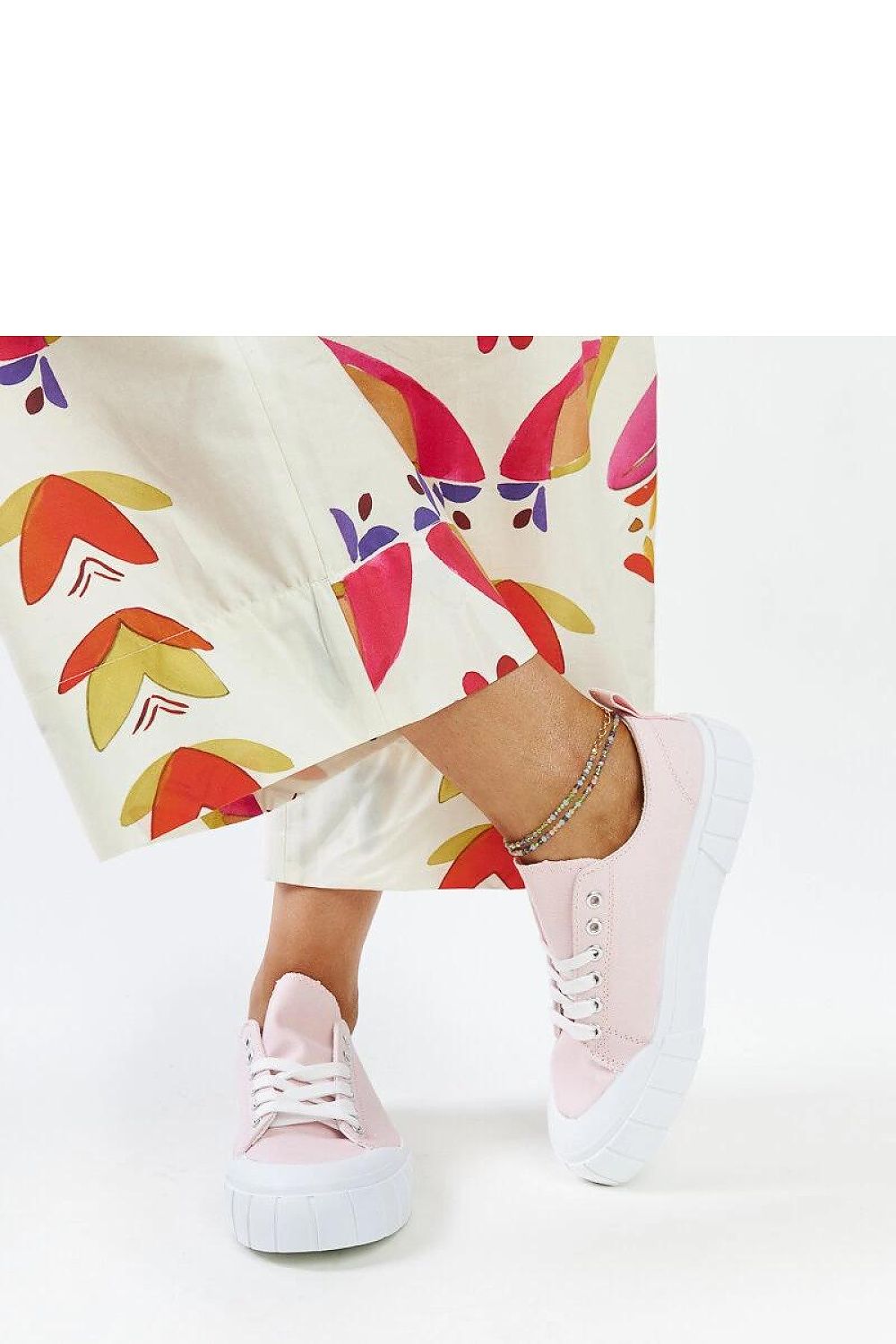 Solea elegant light pink sneakers on a white background, emphasizing the sleek design and luxurious fabric, suitable for all casual occasions.