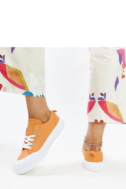 Elegant light pink Solea fabric sneakers on display, revealing the intricate design and craftsmanship ideal for stylish women.