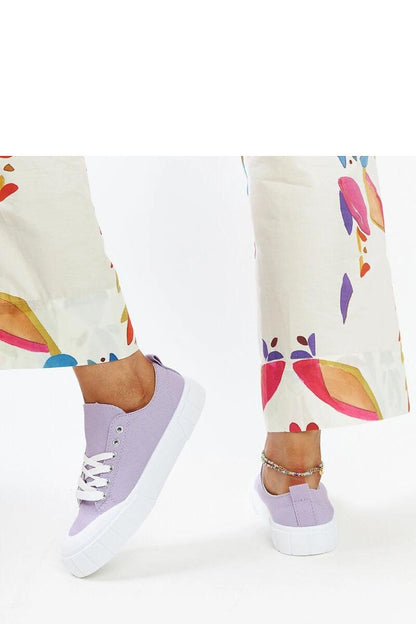 Solea light pink sneakers for women, displayed against a fashionable backdrop, embodying luxury and contemporary style.