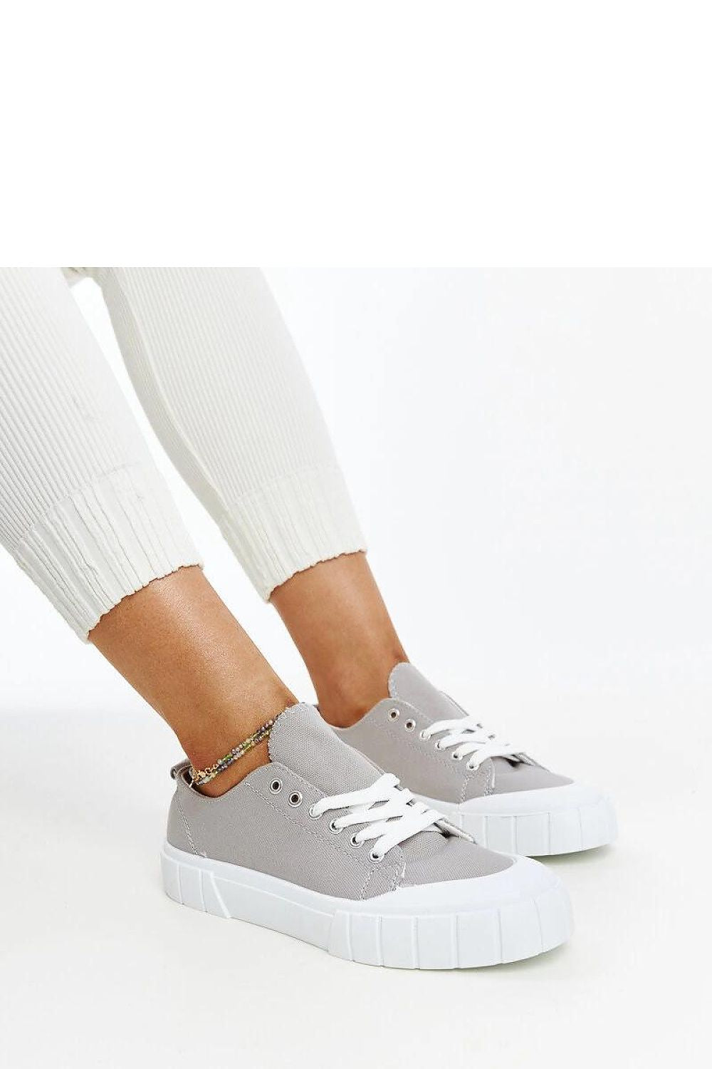 Solea women's light pink fabric sneakers arranged artfully, illustrating their chic design and comfortable wear for spring-summer fashion.