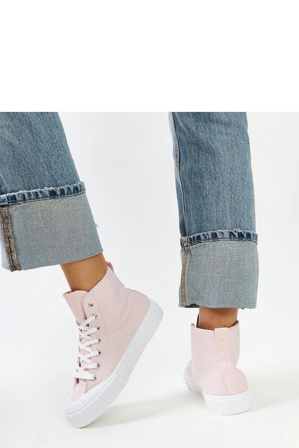 Close-up of Solea pink high-top sneakers, highlighting the elegant fabric upper and rounded front for a luxurious look.