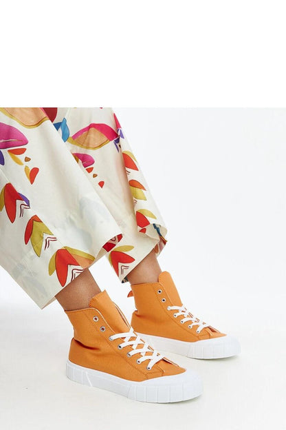 Lifestyle shot featuring Solea pink high-top sneakers on the streets, representing urban style and contemporary flair.