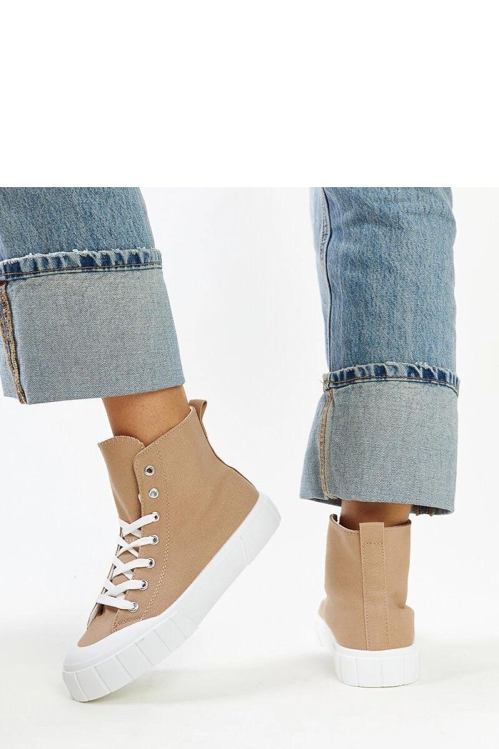 Solea pink high-top sneakers displayed with detailed focus on rubber sole and lacing, epitomizing luxurious urban fashion.