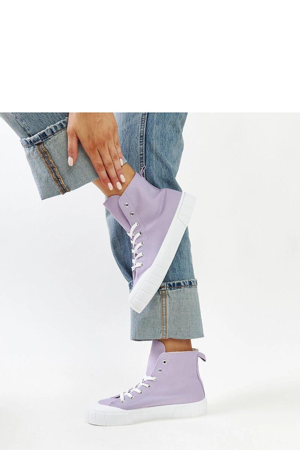 Solea pink high-top sneakers displayed against a trendy urban backdrop, embodying a fashionable lifestyle for women.