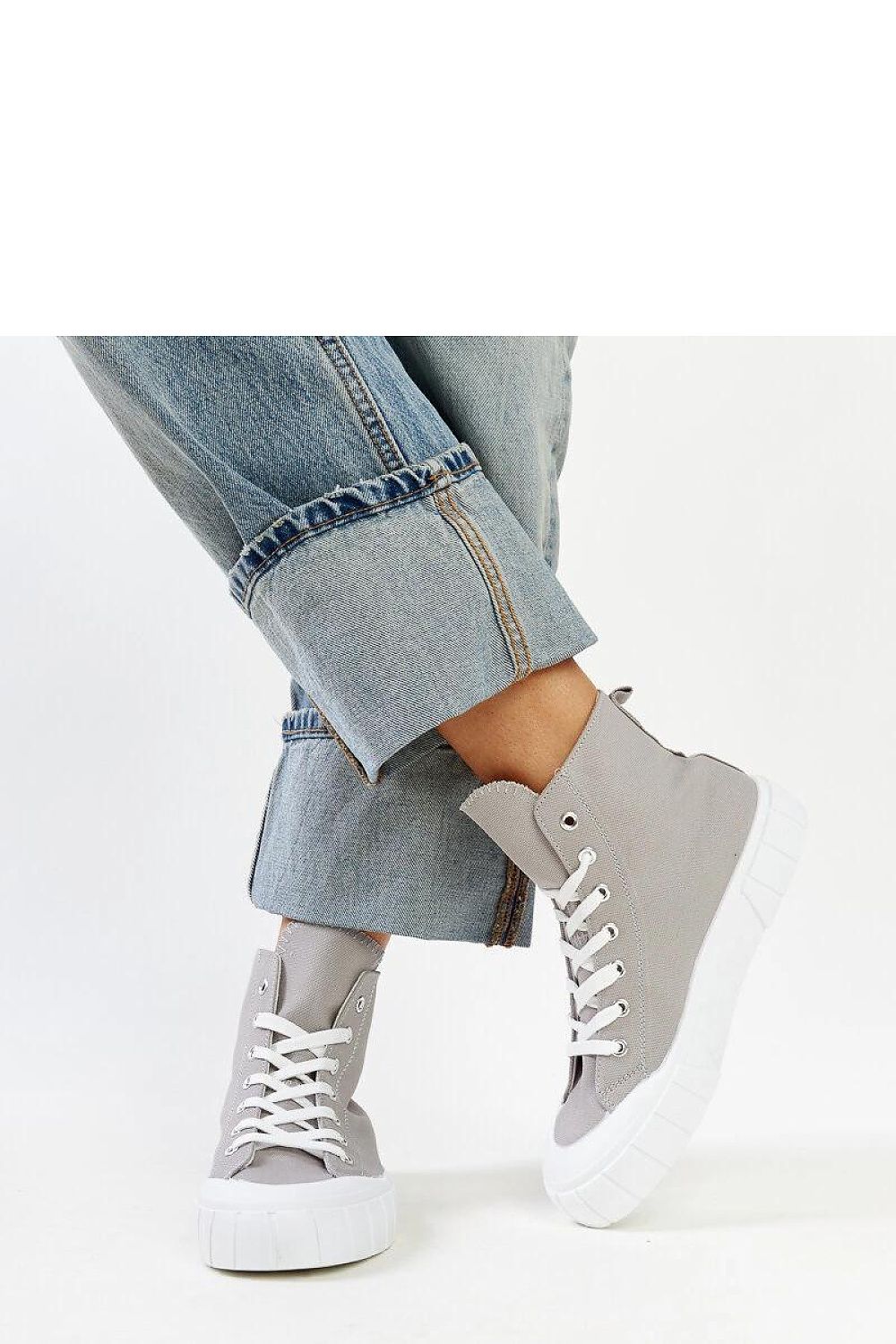 Stylish Solea pink high-top sneakers for women showcasing a laced design and durable rubber sole, perfect for urban chic looks.