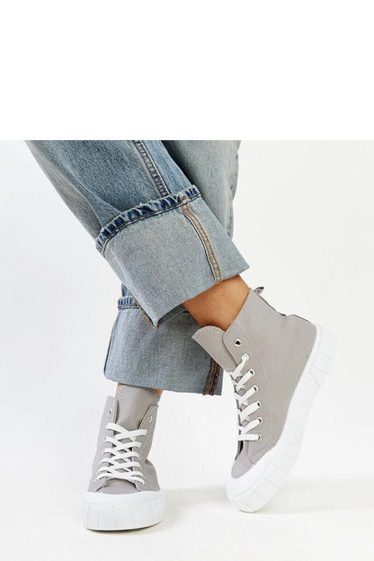 Stylish Solea pink high-top sneakers for women showcasing a laced design and durable rubber sole, perfect for urban chic looks.