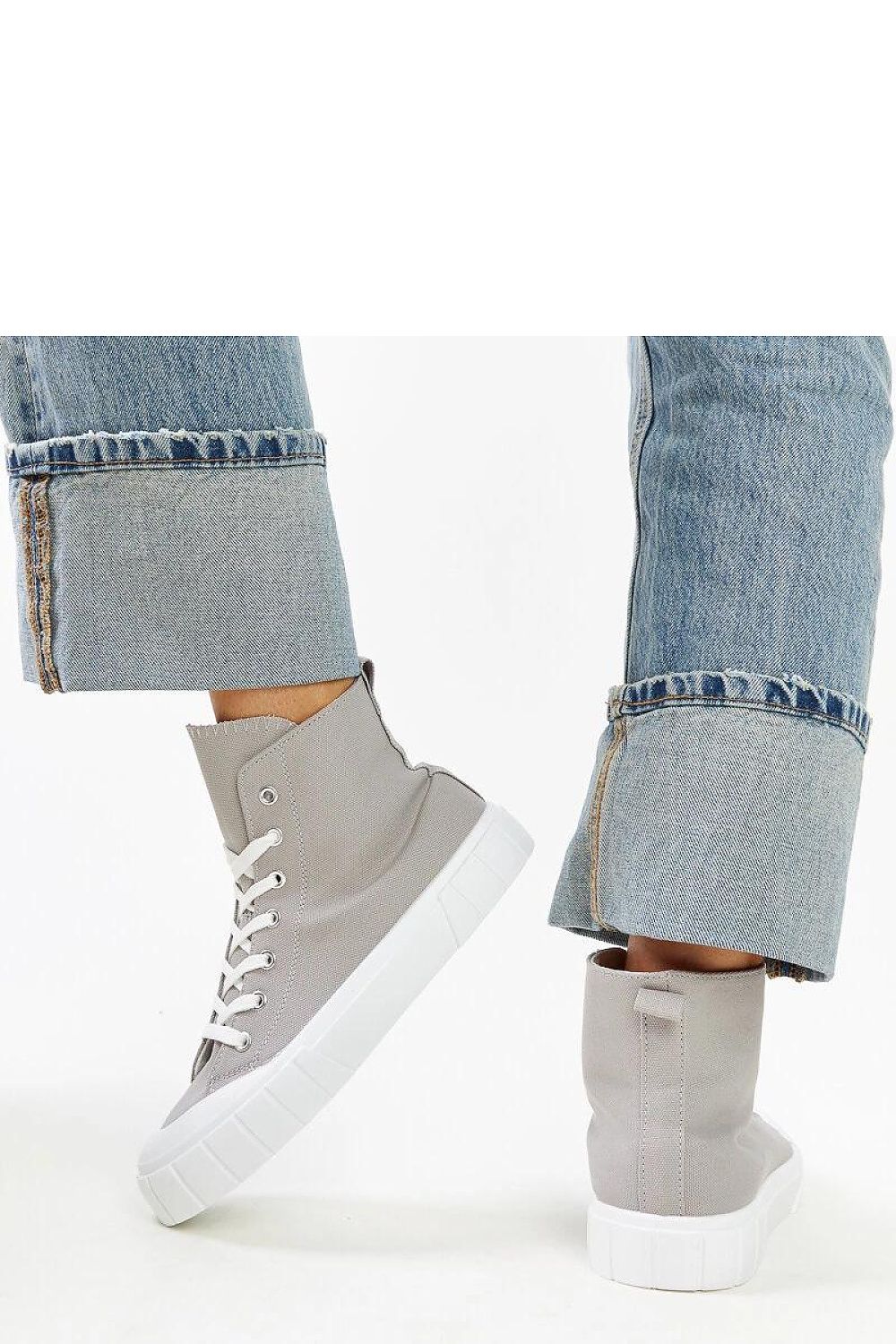 Close-up of Solea women's pink high-top sneakers, highlighting the exquisite laced fastening and quality fabric materials positioning them as a luxury footwear choice.