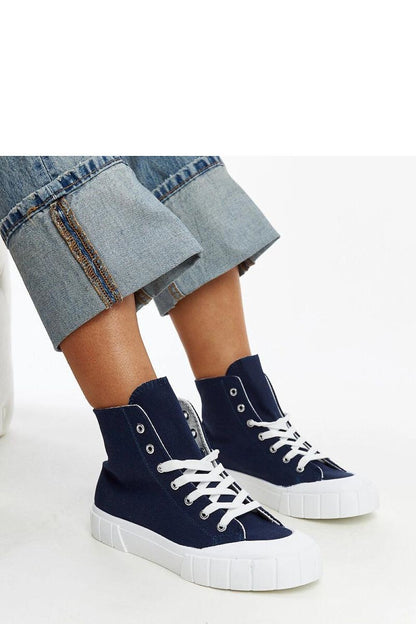 Solea pink high-top sneakers displayed in an urban setting, illustrating their versatility and trendiness ideal for spring and summer fashion.