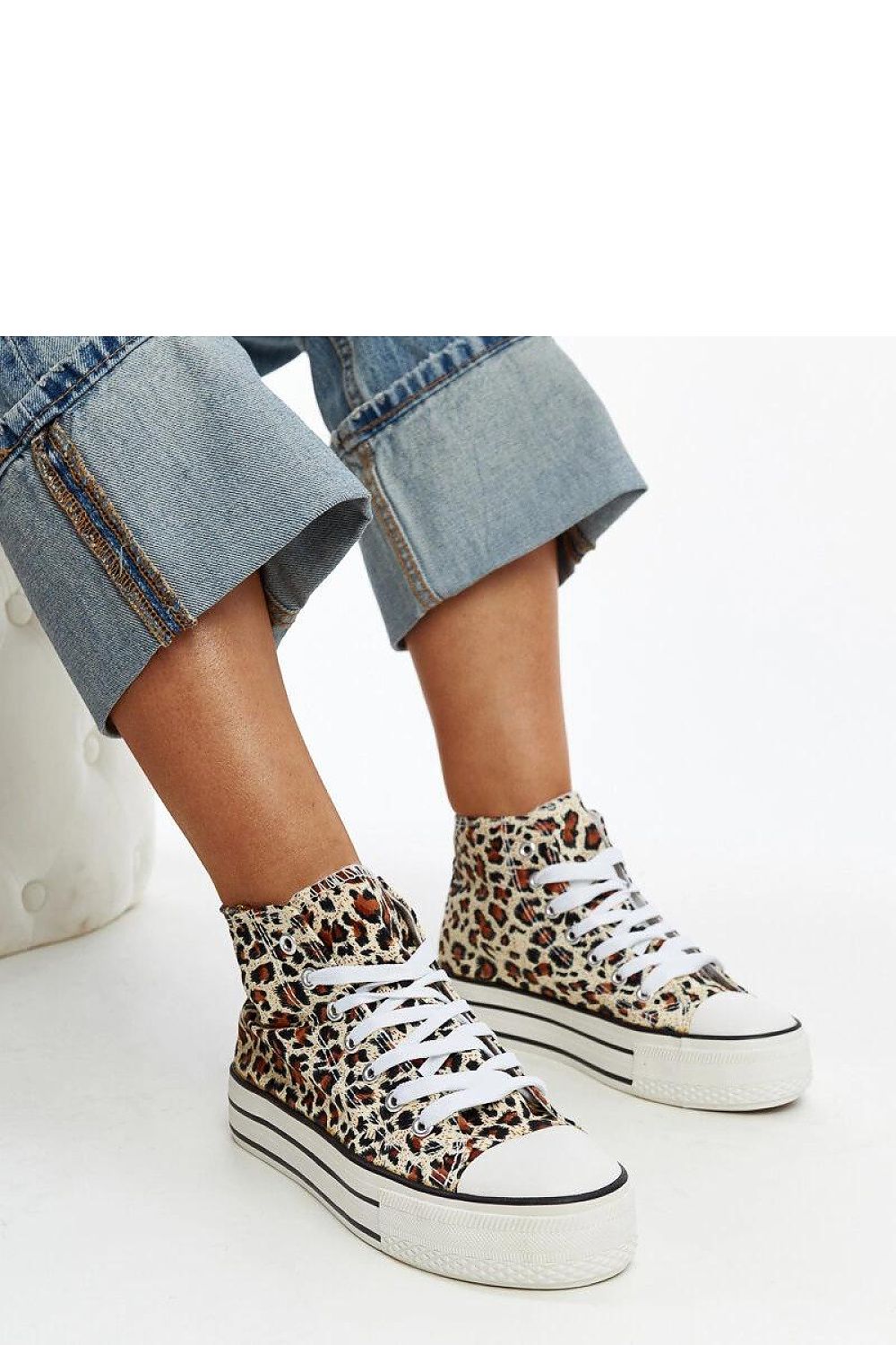Stylish leopard print high-tops featuring a sturdy rubber base by Solea, a must-have for luxury streetwear.