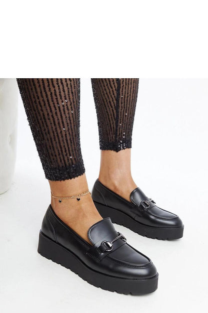 Elegant black wedge moccasins for women by Solea, crafted in eco leather, featuring a slip-on design and a stylish almond-shaped toe, perfect for adding a touch of luxury to any outfit.