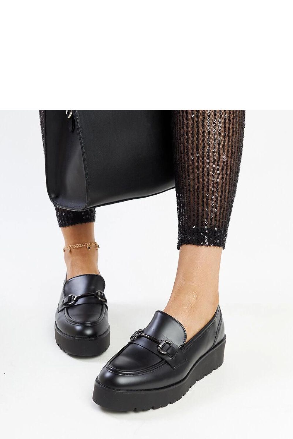 Elegant black wedge moccasins for women by Solea, crafted from eco leather, showcasing a slip-on design with a stylish almond-shaped toe, perfect for adding sophistication to any outfit.