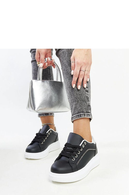 Close-up of Solea's black eco leather sneakers, showcasing intricate zirconia embellishments, ideal for stylish women seeking luxury.