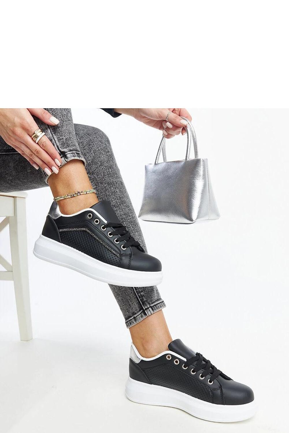 Solea luxury black eco leather women's sneakers on display, highlighting a contemporary lace-up design and comfort for all-day wear.