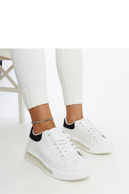 Close-up of Solea White High Sole Sneakers Zrina showing lace-up closure and high sole detailing for an exquisite sporty look.