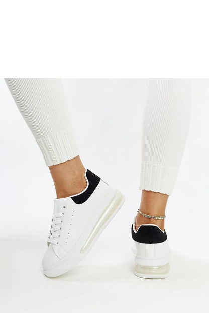 Solea White High Sole Sneakers Zrina on a stylish backdrop, highlighting the luxury of synthetic leather and the trendy high sole.