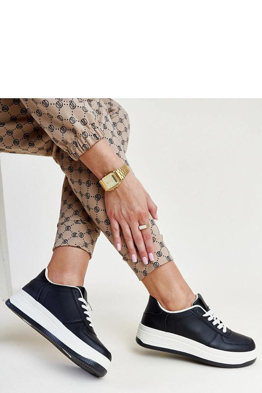 Close-up of Solea Cvita black platform sneakers showcasing the eco leather fabric and chic medium heel, ideal for enhancing leg length.